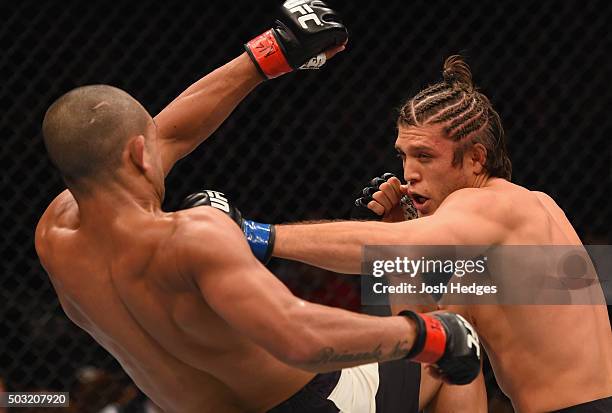 Brian Ortega punches Diego Brandao of Brazil in their featherweight bout during the UFC 195 event inside MGM Grand Garden Arena on January 2, 2016 in...