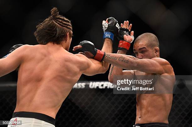 Brian Ortega punches Diego Brandao of Brazil in their featherweight bout during the UFC 195 event inside MGM Grand Garden Arena on January 2, 2016 in...