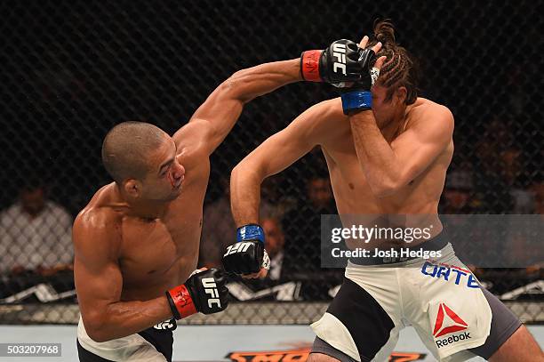 Diego Brandao of Brazil punches Brian Ortega in their featherweight bout during the UFC 195 event inside MGM Grand Garden Arena on January 2, 2016 in...