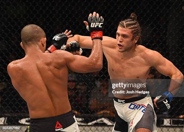 Brian Ortega punches Diego Brandao of Brazil in their featherweight bout during the UFC 195 event inside MGM Grand Garden Arena on January 2, 2016 in...