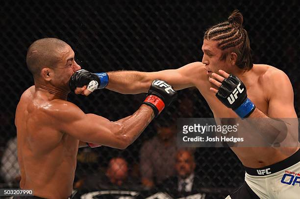 Brian Ortega punches Diego Brandao of Brazil in their featherweight bout during the UFC 195 event inside MGM Grand Garden Arena on January 2, 2016 in...