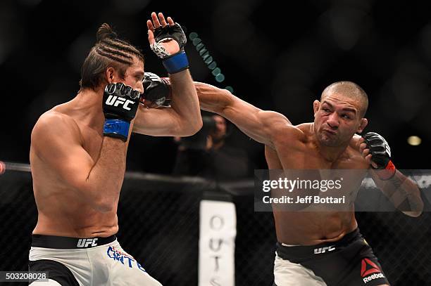 Diego Brandao of Brazil punches Brian Ortega in their featherweight bout during the UFC 195 event inside MGM Grand Garden Arena on January 2, 2016 in...