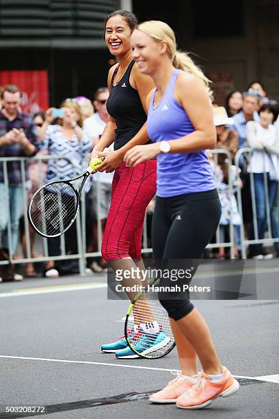 Caroline Wozniacki takes part in an exhibition tennis match with New Zealand netball player Maria Tutaia on January 3, 2016 in Auckland, New Zealand....