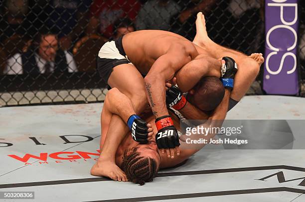 Brian Ortega attempts to submit Diego Brandao of Brazil in their featherweight bout during the UFC 195 event inside MGM Grand Garden Arena on January...