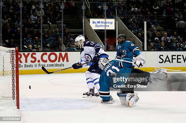 Drew Stafford of the Winnipeg Jets scores a shorthanded goal on Martin Jones of the San Jose Sharks at SAP Center on January 2, 2016 in San Jose,...