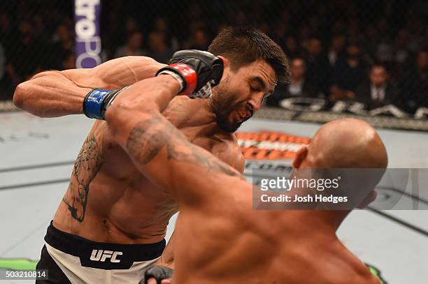 Robbie Lawler punches Carlos Condit in their UFC welterweight championship bout during the UFC 195 event inside MGM Grand Garden Arena on January 2,...