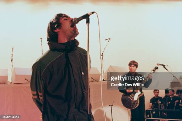 Singer Liam Gallagher and his brother, guitarist Noel Gallagher, performing with British rock band Oasis on Channel 4's live music TV show 'The White...