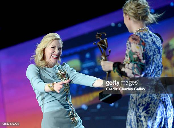 Actress Cate Blanchett accepts the Desert Palm Achievement Award from actress Saoirse Ronan onstage at the 27th Annual Palm Springs International...