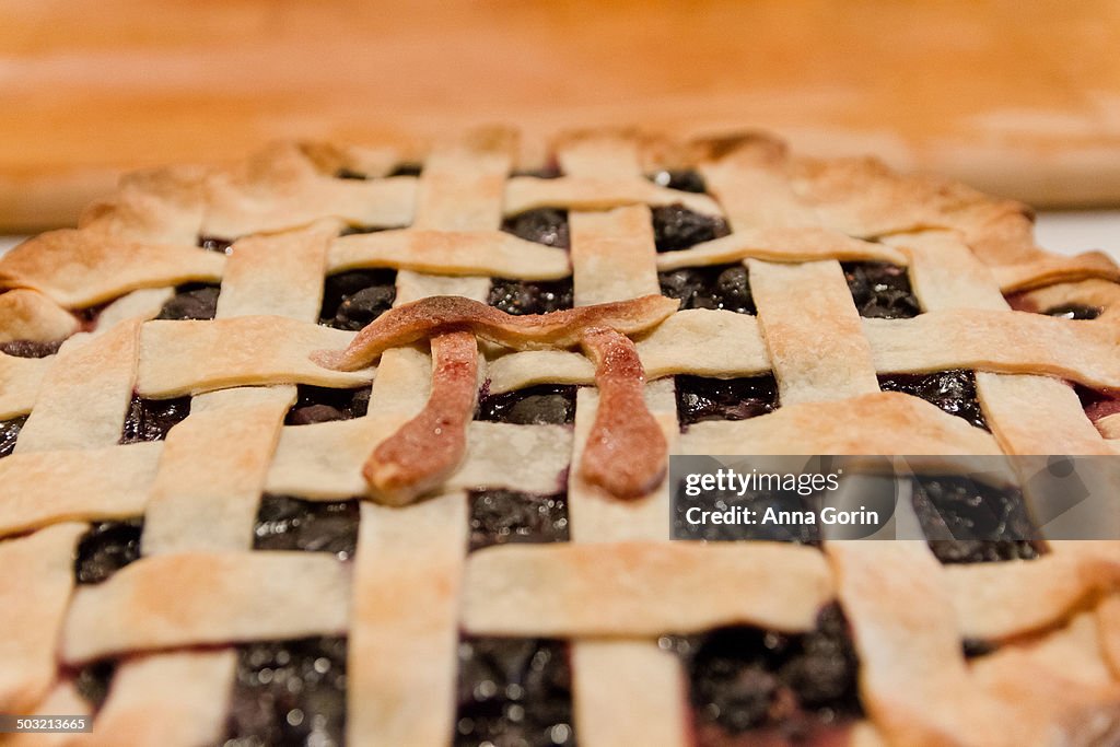 Homemade pie with pastry "pi" symbol decoration
