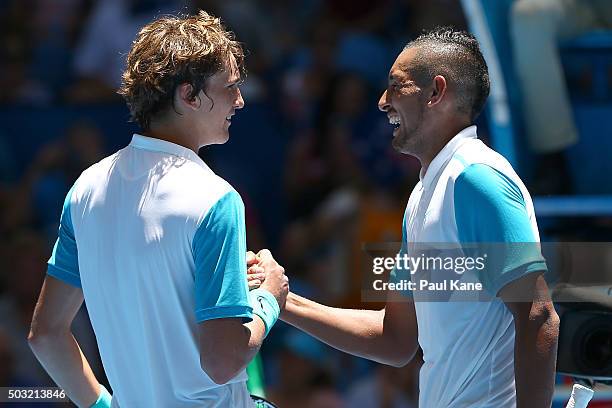 Nick Kyrgios of Australia Green shakes hands with Alexander Zverev of Germany after wnning his match during day one of the 2016 Hopman Cup at Perth...