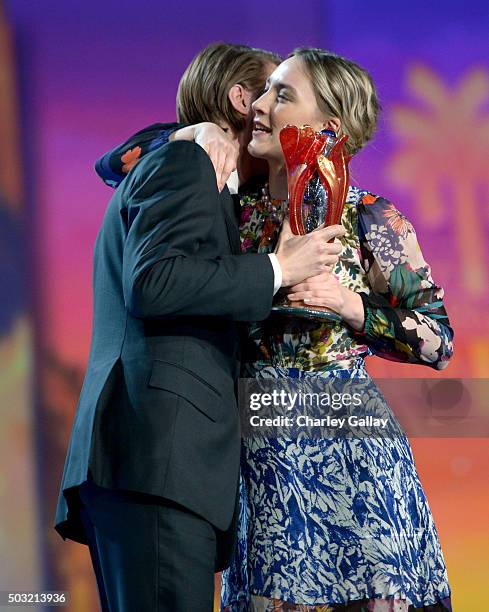 Actress Saoirse Ronan accepts the International Star Award from actor Paul Dano onstage at the 27th Annual Palm Springs International Film Festival...