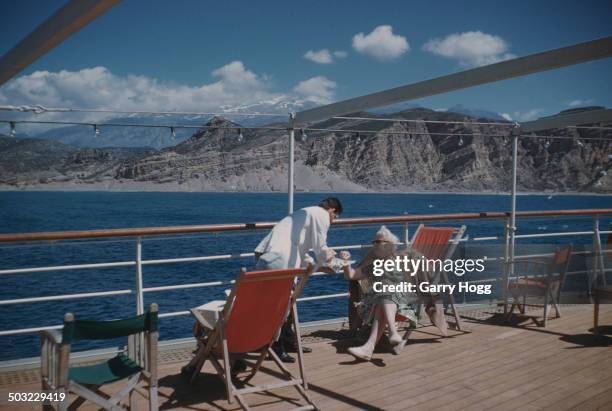 Mid-morning snack on the cruise ship 'Agamemnon', anchored off Agia Galini in southern Crete, Greece, 12th April 1959.