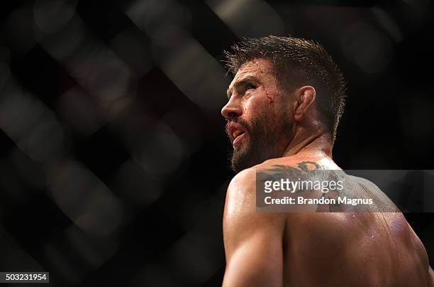 Carlos Condit reacts to his loss to Robbie Lawler in their welterweight championship fight during the UFC 195 event inside MGM Grand Garden Arena on...