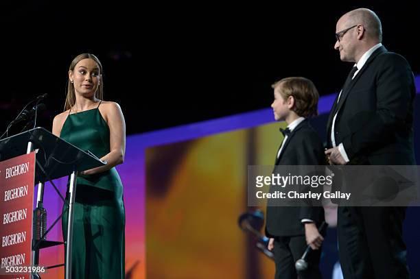 Actress Brie Larson accepts the Breakthrough Performance Award onstage from actor Jacob Tremblay and director Lenny Abrahamson at the 27th Annual...