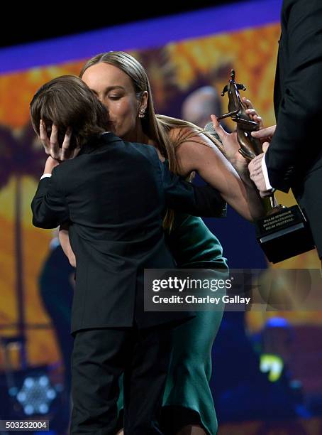 Actress Brie Larson accepts the Breakthrough Performance Award onstage from actor Jacob Tremblay and director Lenny Abrahamson at the 27th Annual...