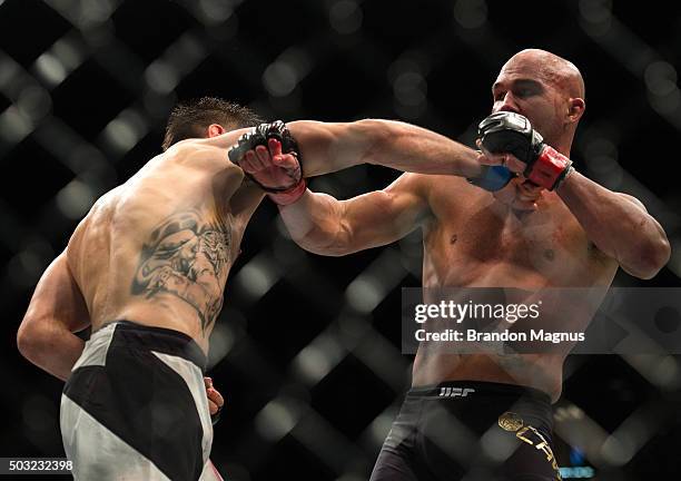 Carlos Condit punches Robbie Lawler in their welterweight championship fight during the UFC 195 event inside MGM Grand Garden Arena on January 2,...