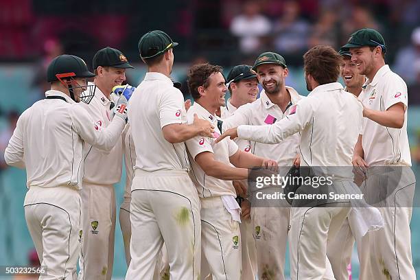 Steve O'Keefe of Australia is congratulated by team mates after dismissing Jason Holder of West Indies caught by Joe Burns during day one of the...