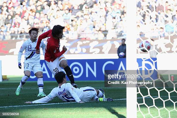 Shinzo Koroki of Urawa Red Diamonds scores his team's first goal during the 95th Emperor's Cup final between Urawa Red Diamonds and Gamba Osaka at...