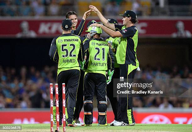 Chris Hartley of the Thunder and team mates celebrate after the stumping of Jimmy Peirson of the Heat during the Big Bash League match between the...