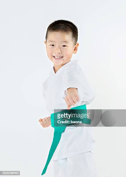punching boy - taekwondo kids stockfoto's en -beelden