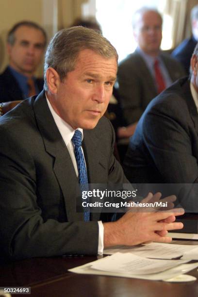 President George W. Bush holding a cabinet meeting in the Cabinet Room in the West Wing of the White House. The President answered reporters...