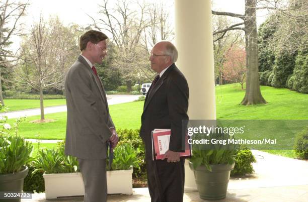 Trade Representative Robert B. Zoellick and Vice President Dick Cheney being photographed unexpectedly speaking on the colonnade outside the Oval...