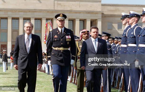 Secretary of Defense Donald H. Rumsfeld and Commander of Troops Col. Thomas M. Jordan, U.S. Army, escorting Jordan's King Abdullah II as he inspects...