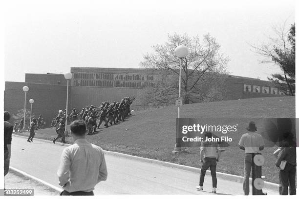 Students watch as Ohio National Guard troops march on campus during an anti-war demonstration at Kent State University, Kent, Ohio, May 4, 1970. Four...