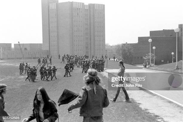 Students watch as Ohio National Guard troops march on campus during an anti-war demonstration at Kent State University, Kent, Ohio, May 4, 1970. Four...