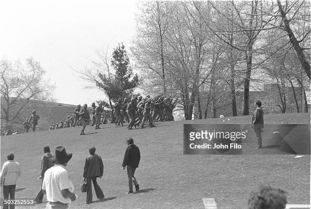Students watch as Ohio National Guard troops march on campus during an anti-war demonstration at Kent State University, Kent, Ohio, May 4, 1970. Four...