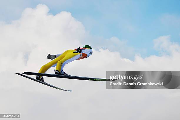 Peter Prevc of Slovenia soars through the air during his trial jump on Day 2 of the Innsbruck 64th Four Hills Tournament ski jumping event on January...