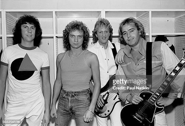 Portrait of the American-based rock band Foreigner as they pose backsatge at the Rosemont Horizon, Rosemont, Illinois, November 8, 1981. Pictured...