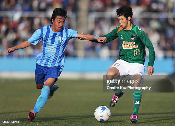 Yuta Kamiya of Aomori Yamada and Kotaro Kuwahara of Toko Gakuen compete for the ball during the 94th All Japan High School Soccer Tournament third...