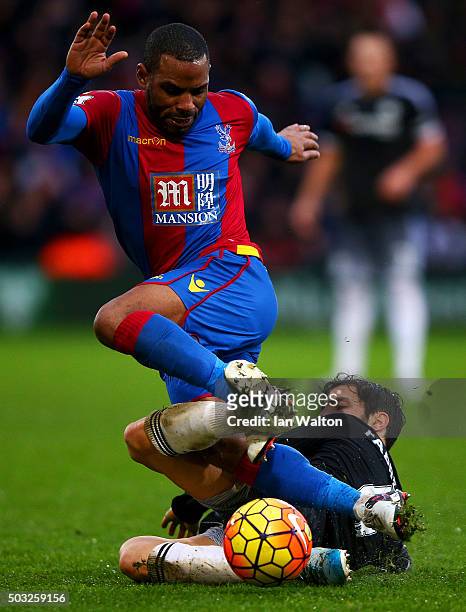Jason Puncheon of Crystal Palace battles for the ball with Cesc Fabregas of Chelsea during the Barclays Premier League match between Crystal Palace...