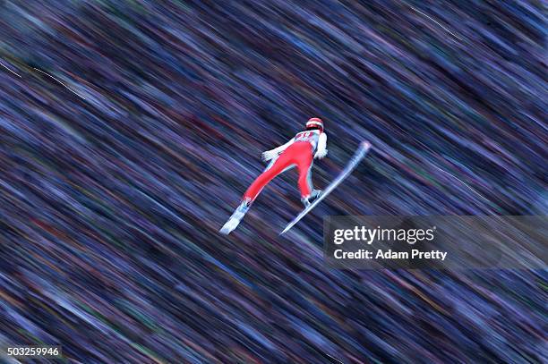 Andreas Wank of Germany soars through the air and over the grandstand during his final competition jump on day 2 of the Innsbruck 64th Four Hills...