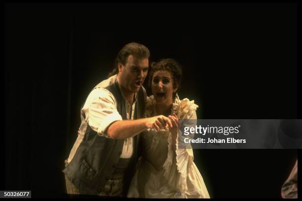 Baritone Bryn Terfel as Figaro w. Soprano Dawn Upshaw as Susanna in Mozart's Le Nozze di Figaro on stage at the Metropolitan Opera.