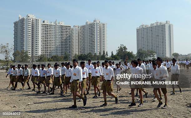 Indian right wing Rashtriya Swayamsevak Sangh volunteers arrive at a rally in Pune some 135 kms from Mumbai on January 3, 2016. Over 150,000 RSS...