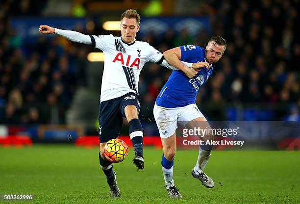 Christian Eriksen of Tottenham Hotspur battles for the ball with Tom Cleverley of Everton during the Barclays Premier League match between Everton...