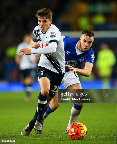 Tom Carroll of Tottenham Hotspur battles for the ball with Tom Cleverley of Everton during the Barclays Premier League match between Everton and...