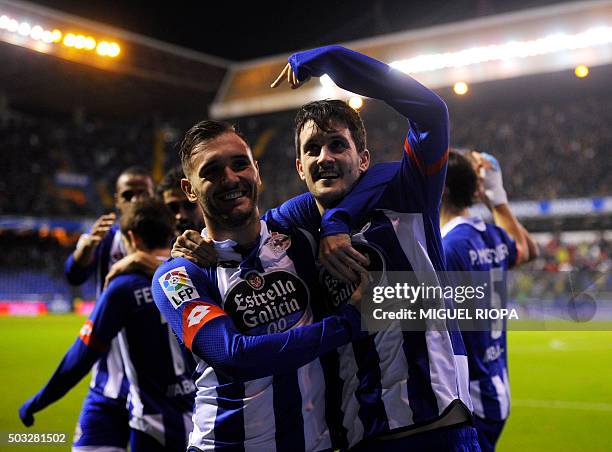 Deportivo La Coruna's midfielder Luis Alberto celebrates with teammate midfielder Lucas Perez after scoring a goal during the Spanish league football...