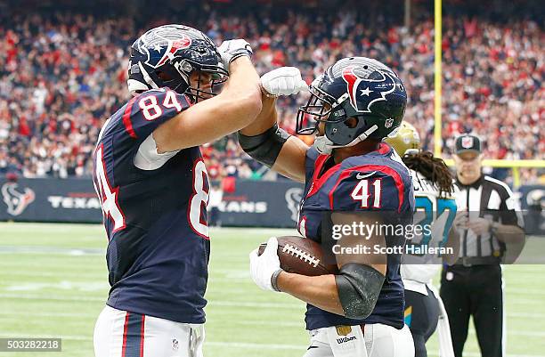 Ryan Griffin of the Houston Texans celebrates Jonathan Grimes touchdown against the Jacksonville Jaguars in the first quarter on January 3, 2016 at...