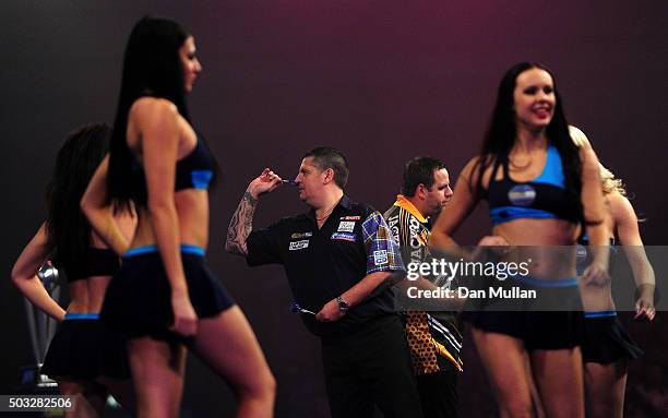 Gary Anderson of Scotland takes a practice throw ahead of the final match against Adrian Lewis of England during Day Fifteen of the 2016 William Hill...