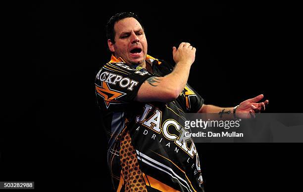 Adrian Lewis of England celebrates winning the second set against Gary Anderson of Scotland in the final match during Day Fifteen of the 2016 William...
