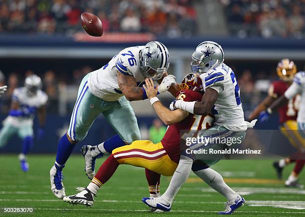 Terrance Mitchell of the Dallas Cowboys makes the sack against Colt McCoy of the Washington Redskins along with Greg Hardy in the second quarter at...