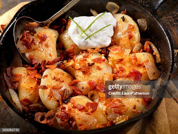 pan fried pierogies - sour cream stock pictures, royalty-free photos & images