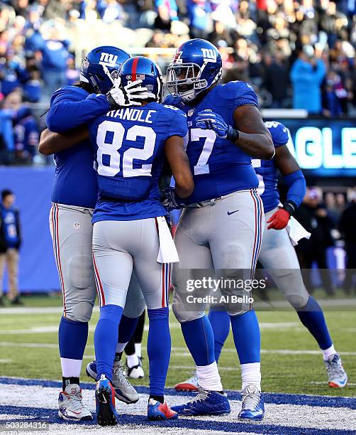 Rueben Randle of the New York Giants celebrates with his teammates after scoring a 45 yard touchdown in the third quarter to take the lead in their...