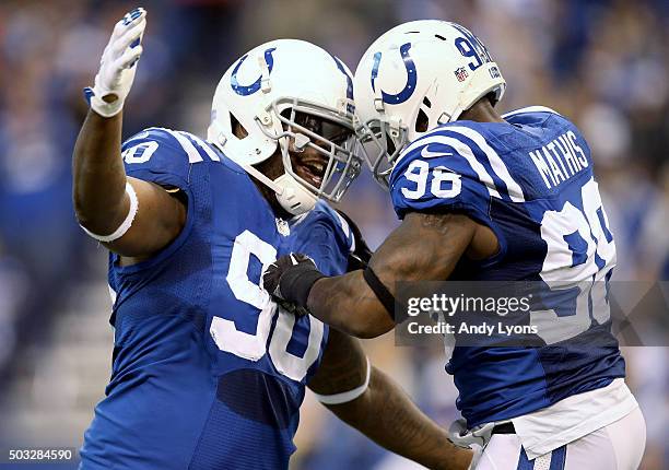 Kendall Langford and Robert Mathis of the Indianapolis Colts celebrate during the game against the Tennessee Titans at Lucas Oil Stadium on January...