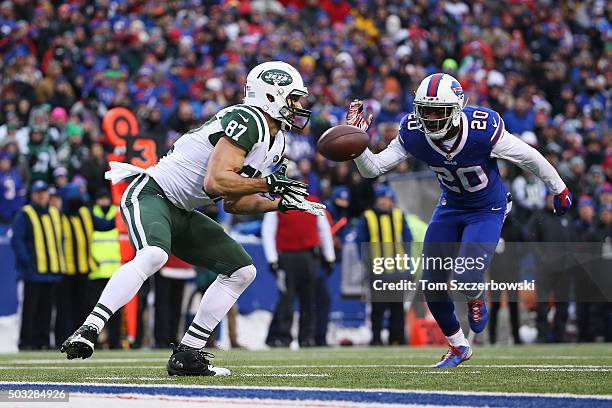 Eric Decker of the New York Jets catches a touchdown pass in front of Corey Graham of the Buffalo Bills during the second half at Ralph Wilson...