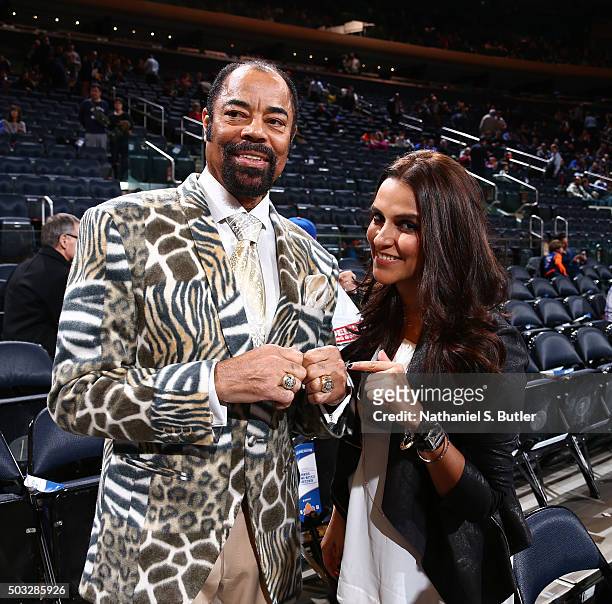 Walt Frazier speaks with Bollywood actress Neha Dhupia before the game against the Atlanta Hawks on January 3, 2016 at Madison Square Garden in New...
