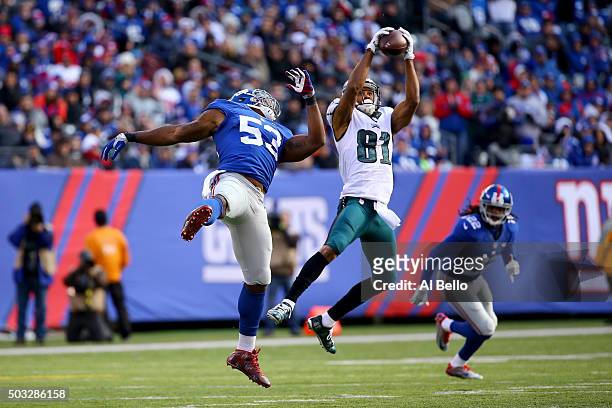 Jordan Matthews of the Philadelphia Eagles catches a pass in the first half against Jasper Brinkley of the New York Giants during their game at...